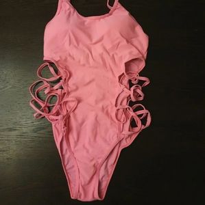 Pink swimsuit with cut out sides